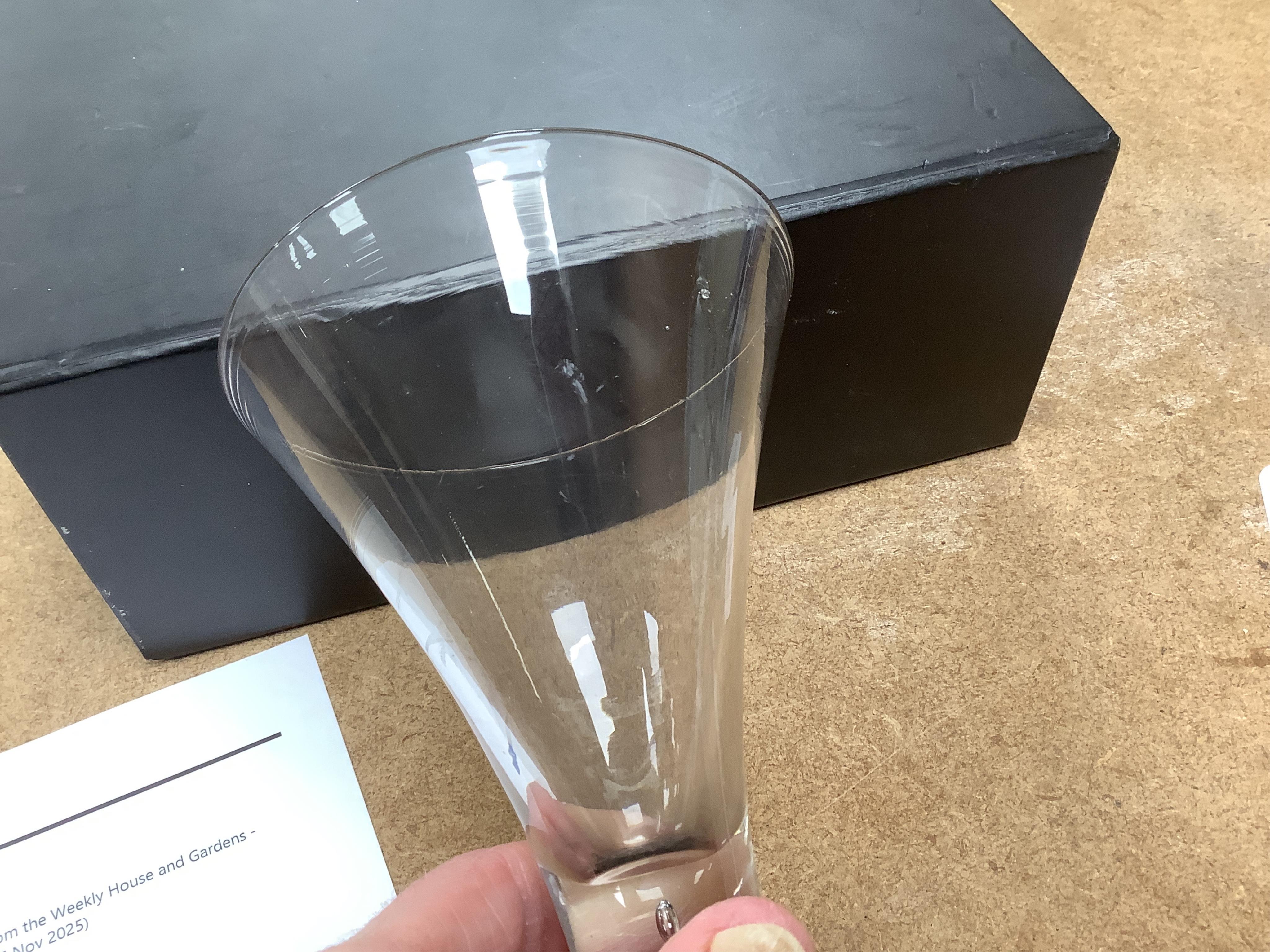 Three late 18th century trumpet glasses, all with plain stems containing tears, tallest 21cm